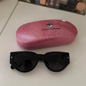 Black Diva's Eye sunglasses with Eye Star logo. Lens protection